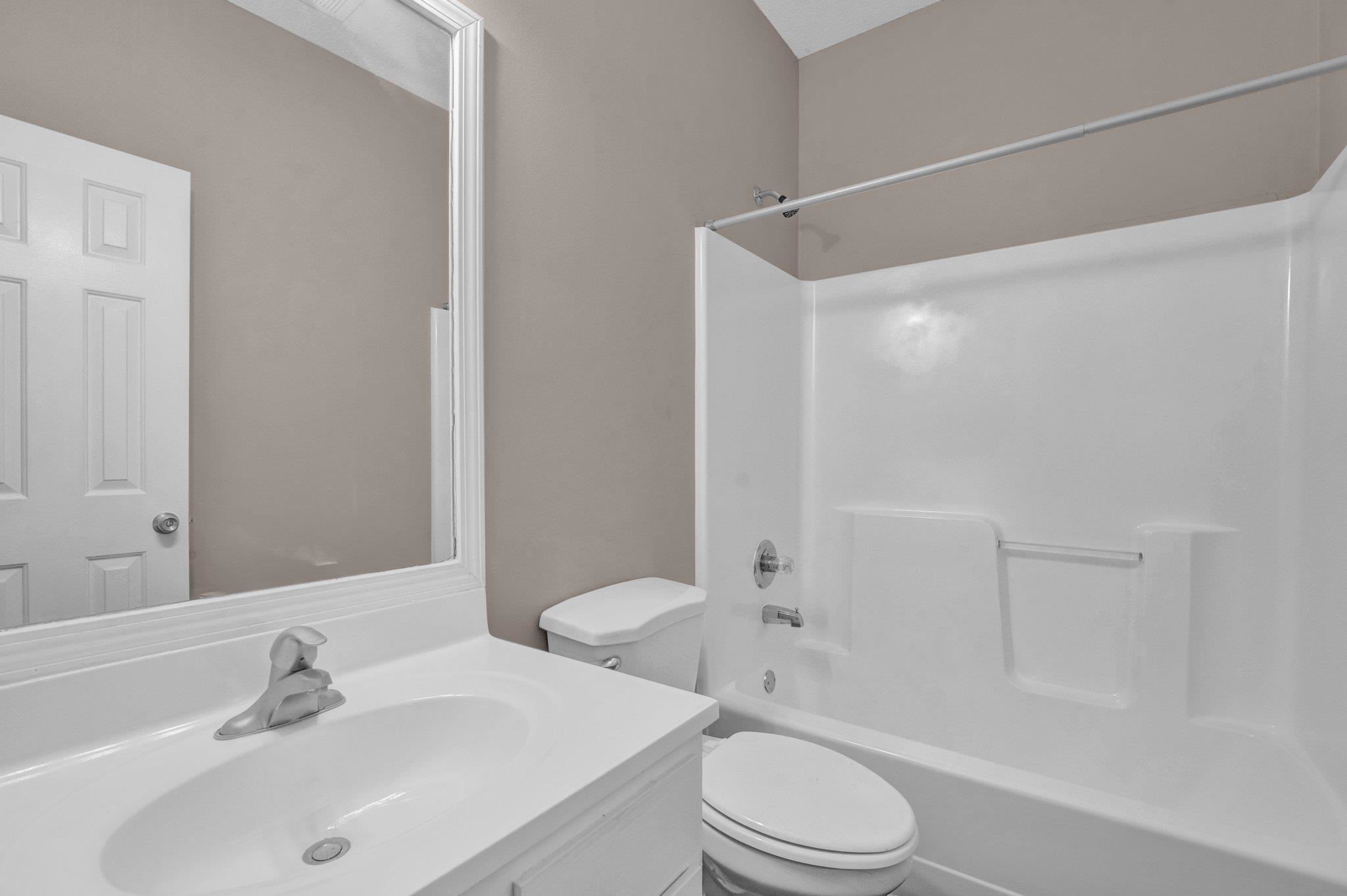 6309 Ragan Farm Drive Memphis, TN 38141 - Photo 19 of 25 Full bathroom featuring shower / tub combination, vanity, and toilet