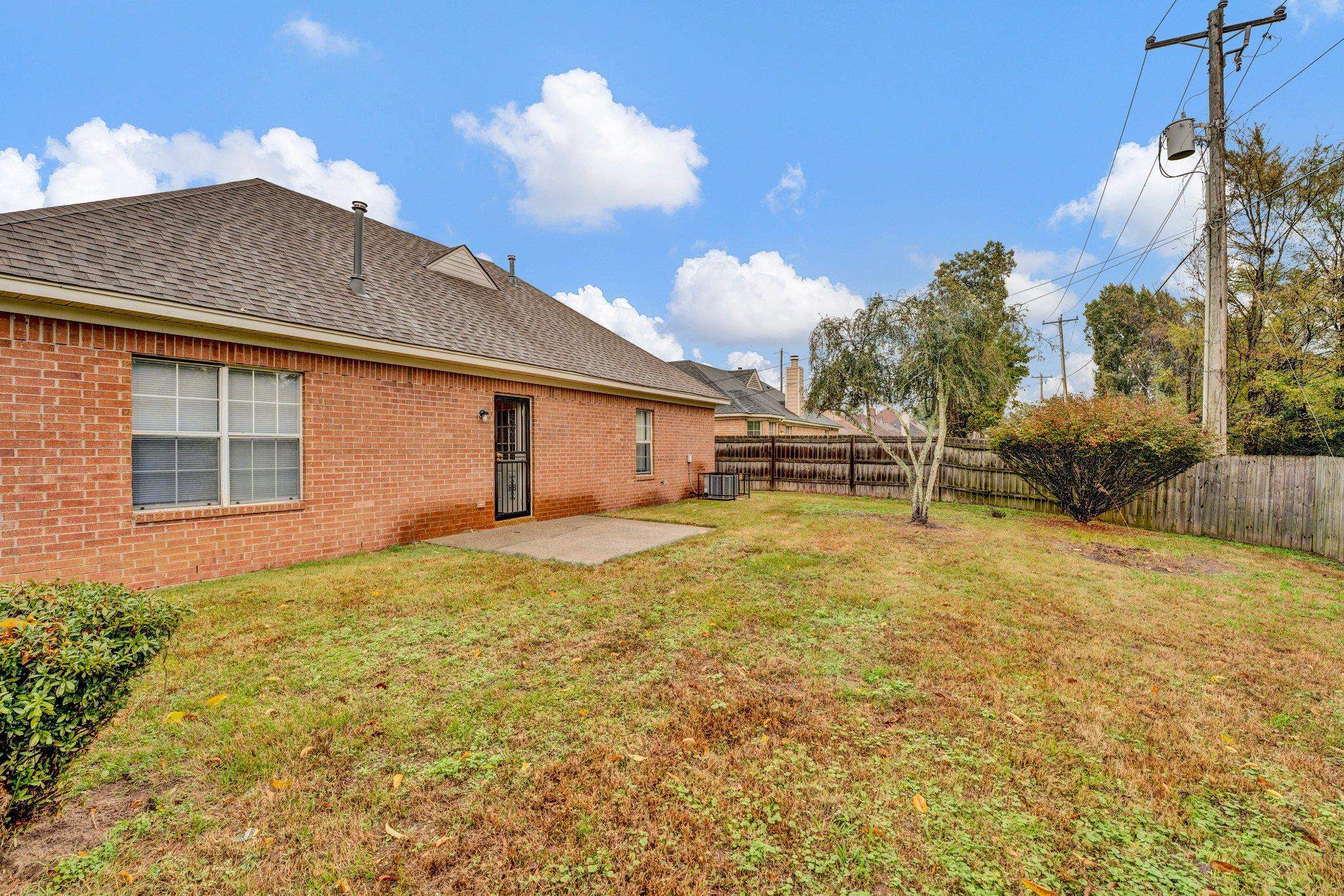 6309 Ragan Farm Drive Memphis, TN 38141 - Photo 23 of 25 View of yard with central air condition unit and a patio area