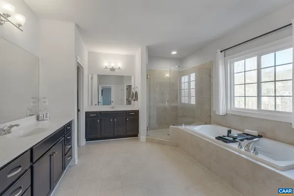 a view of a storage and utility room with washer and dryer