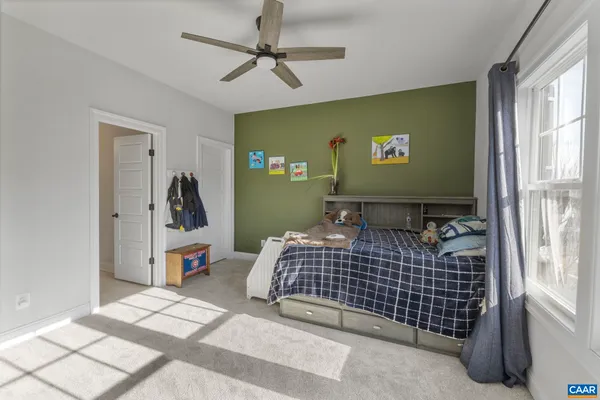 a view of a room with furniture and wooden floor