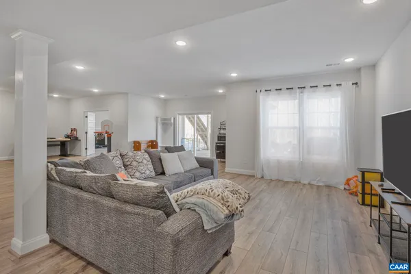 a front view of house with yard and car parked