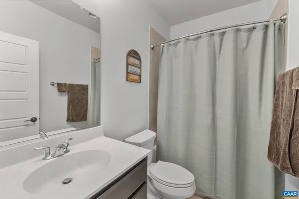 a bathroom with a shower curtain