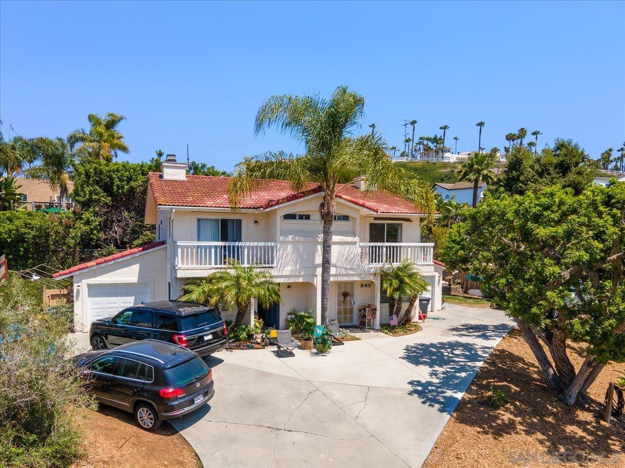 838 Valley Avenue Solana Beach, CA 92075 - Photo 4 of 16 a front view of a house with a yard and outdoor seating