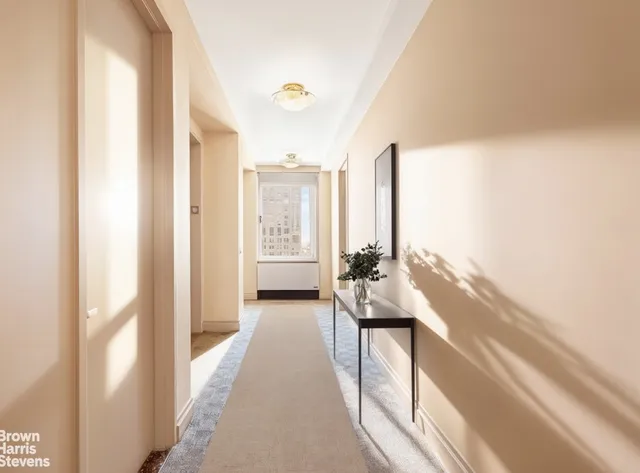 a en suite bathroom with a granite countertop sink and a large mirror