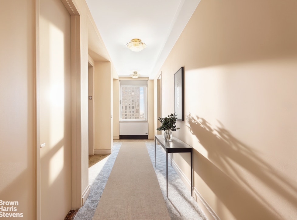 a en suite bathroom with a granite countertop sink and a large mirror