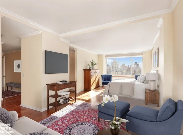 a bedroom with a bed and a couch