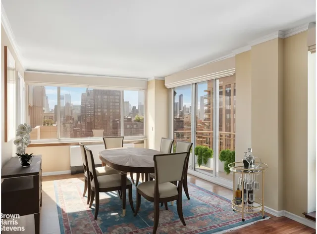 a living room with furniture and a floor to ceiling window