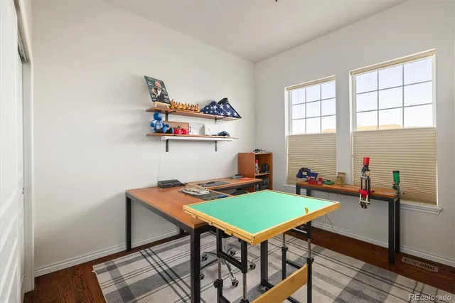 a workspace with furniture and window