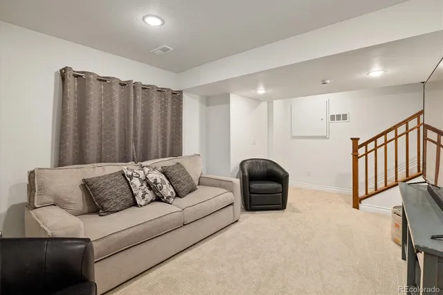 a living room with furniture and a couch