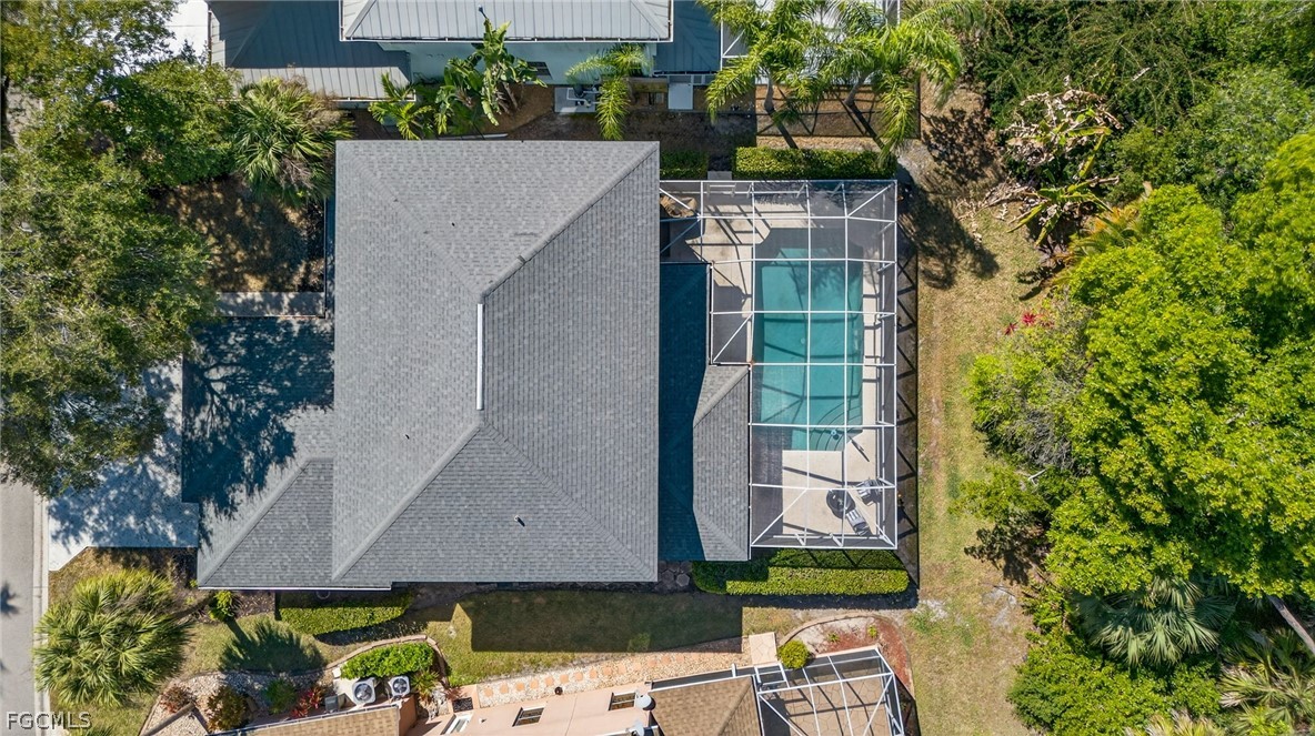22866 Forest Ridge Drive Estero, FL 33928 - Photo 36 of 38 an aerial view of a house with a yard and potted plants