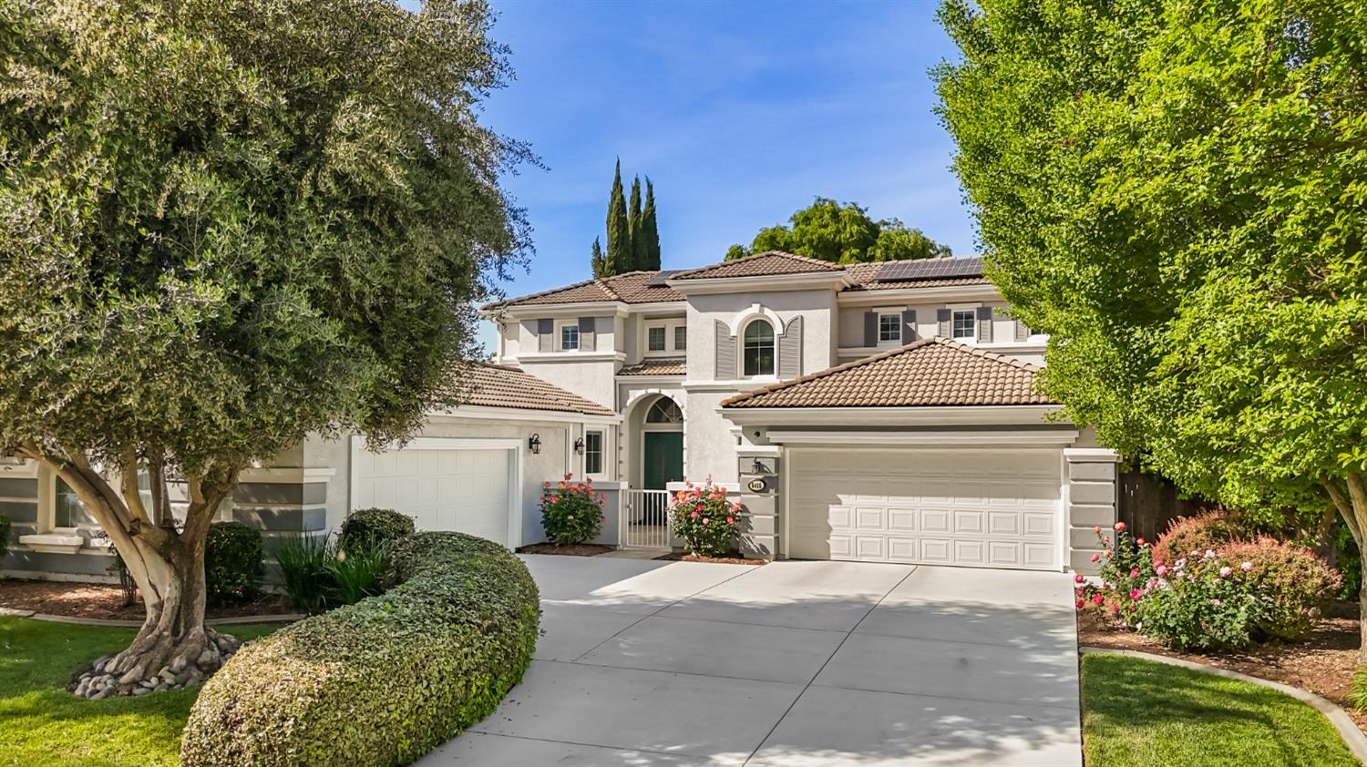 5415 Rogers Street Davis, CA 95618 - Photo 2 of 77 a front view of a house with a garden