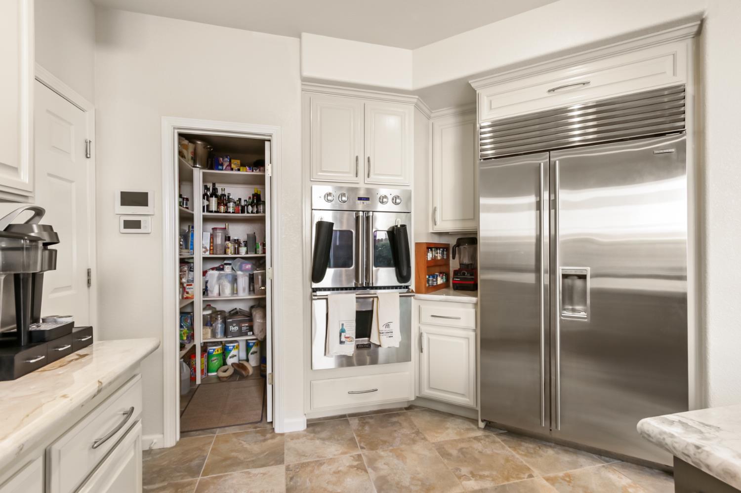 5415 Rogers Street Davis, CA 95618 - Photo 25 of 77 a kitchen with stainless steel appliances a refrigerator and a stove