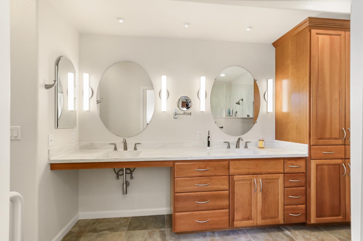 5415 Rogers Street Davis, CA 95618 - Photo 32 of 77 a bathroom with a double vanity sink and a mirror