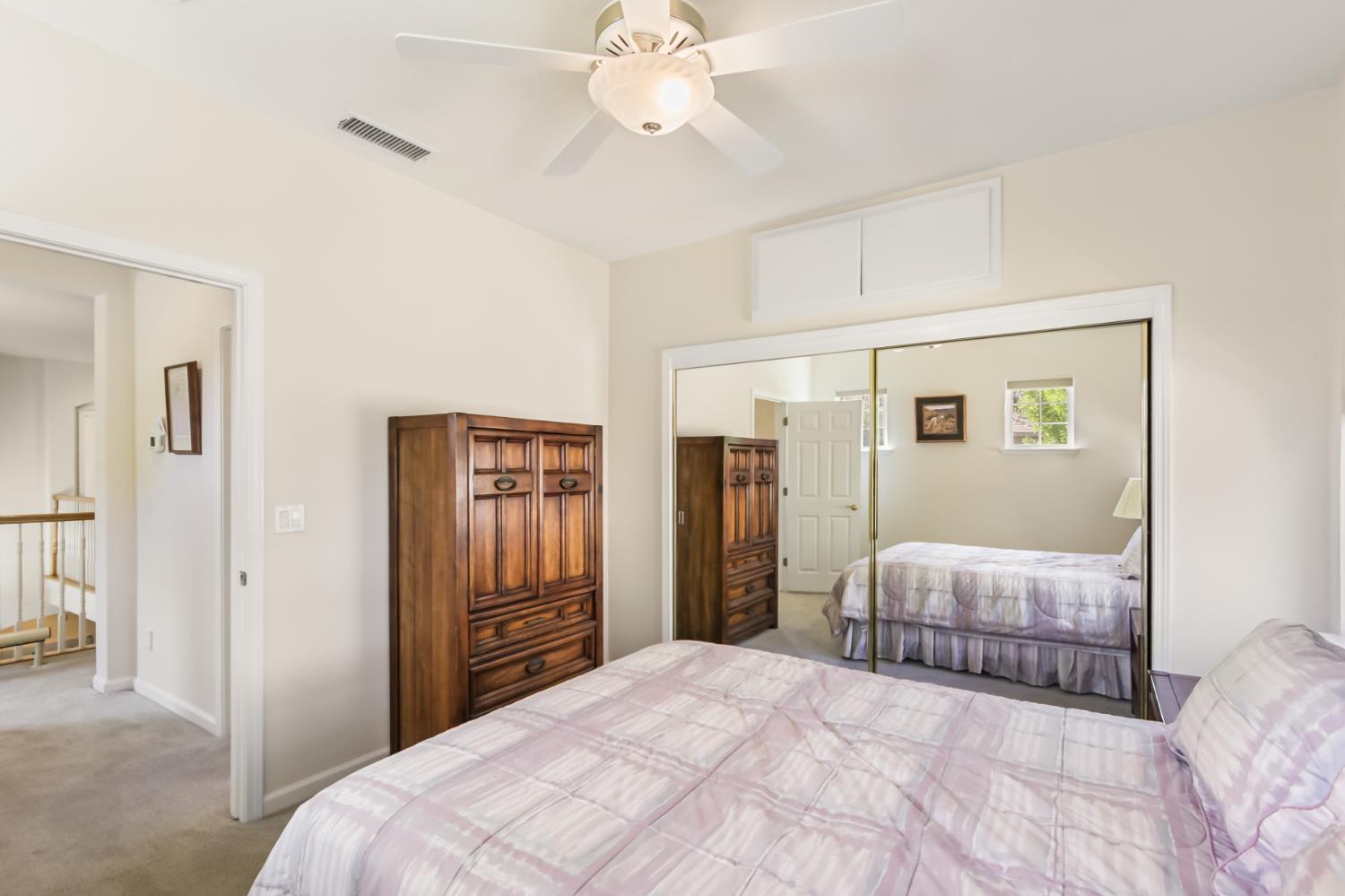 5415 Rogers Street Davis, CA 95618 - Photo 45 of 77 a bedroom with a large bed and a chandelier