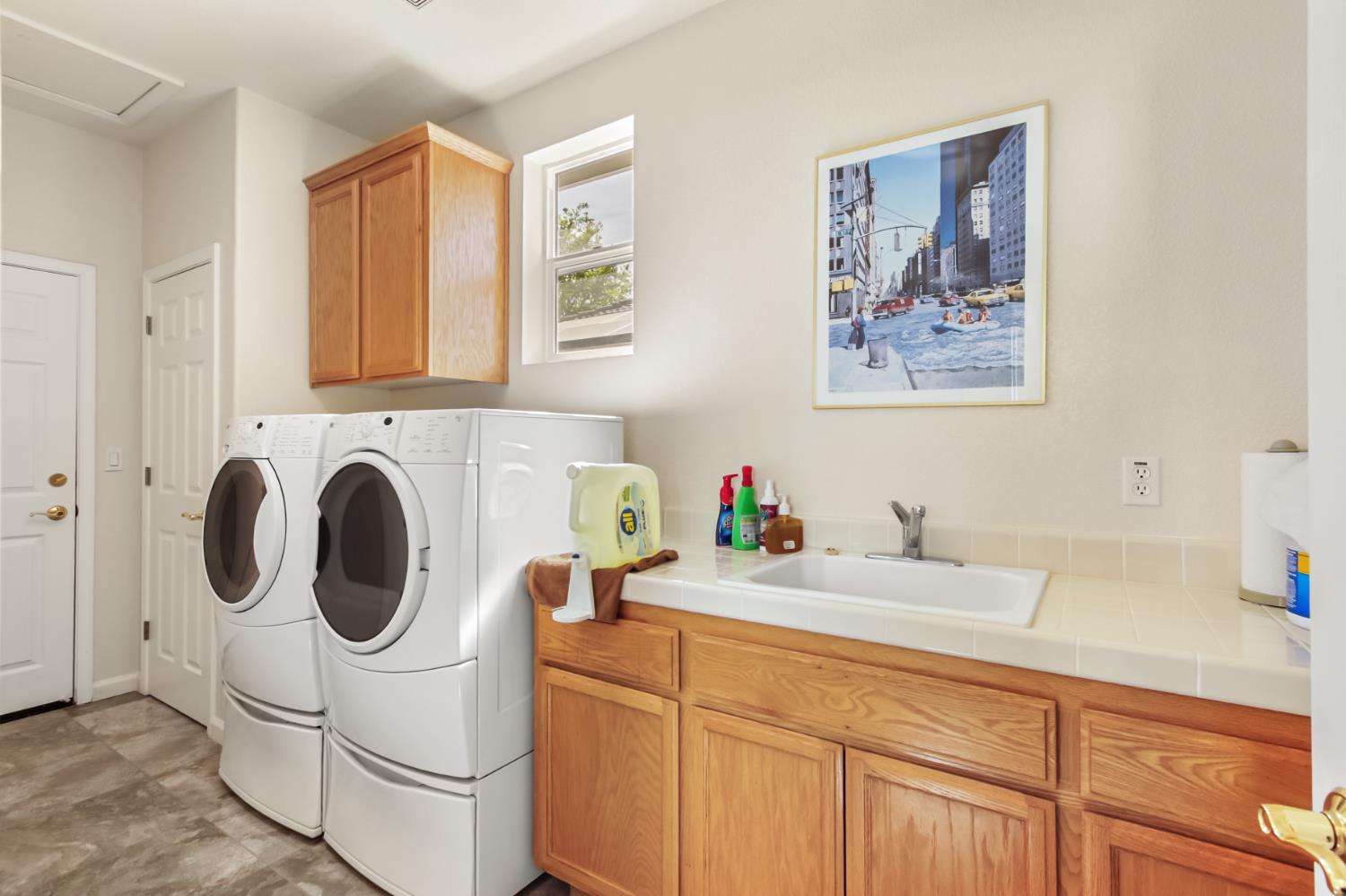 5415 Rogers Street Davis, CA 95618 - Photo 53 of 77 a utility room with sink dryer and washer