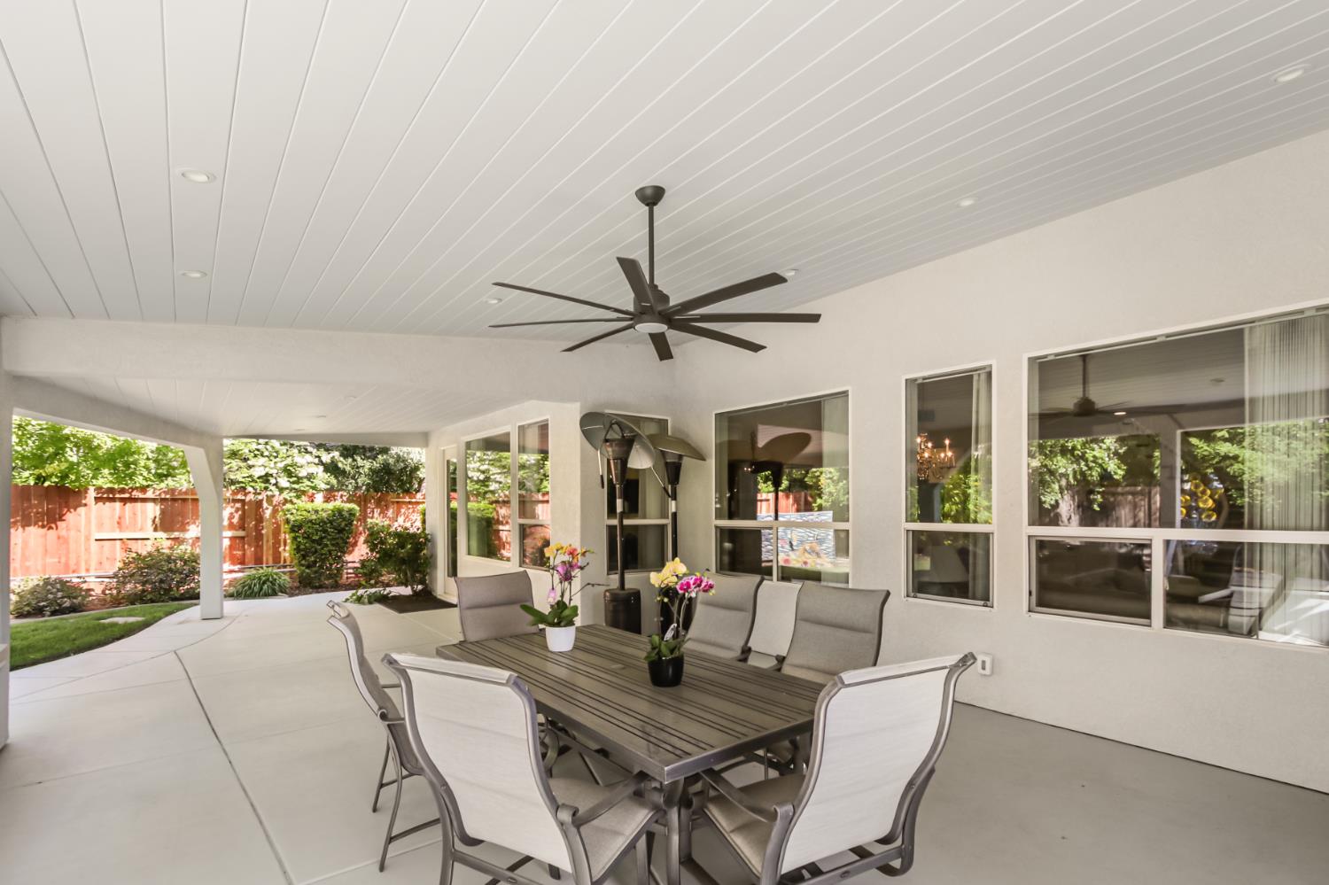 5415 Rogers Street Davis, CA 95618 - Photo 60 of 77 a living room with furniture a floor to ceiling windows and a floor to ceiling window