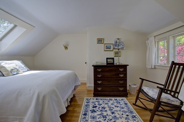 40 Glen Road Winchester, MA 01890 - Photo 27 of 30 a bedroom with a bed and wooden floor