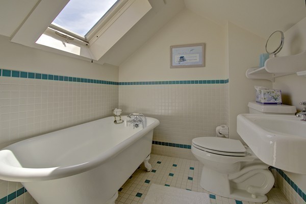 40 Glen Road Winchester, MA 01890 - Photo 28 of 30 a white bath tub sitting next to a white toilet
