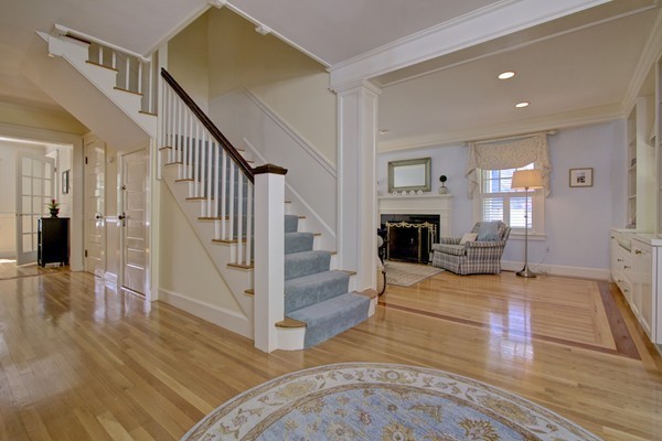 40 Glen Road Winchester, MA 01890 - Photo 4 of 30 a view of a livingroom with wooden floor and a fireplace