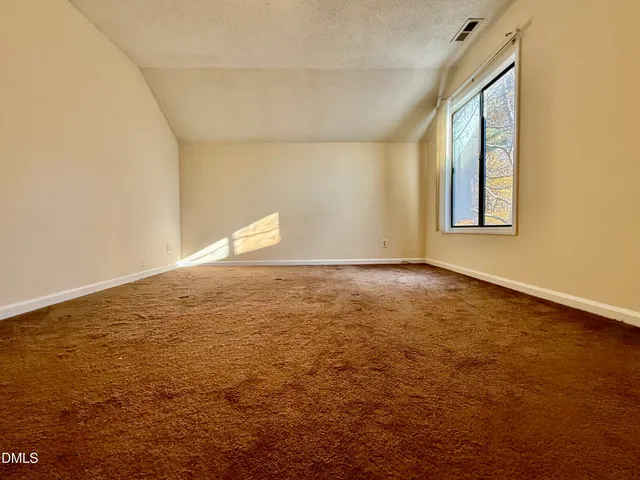 an empty room with a natural light