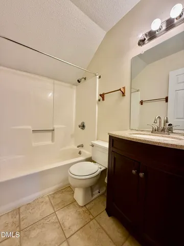 a bathroom with a sink toilet a mirror and shower