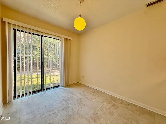 a view of a room with sliding glass door