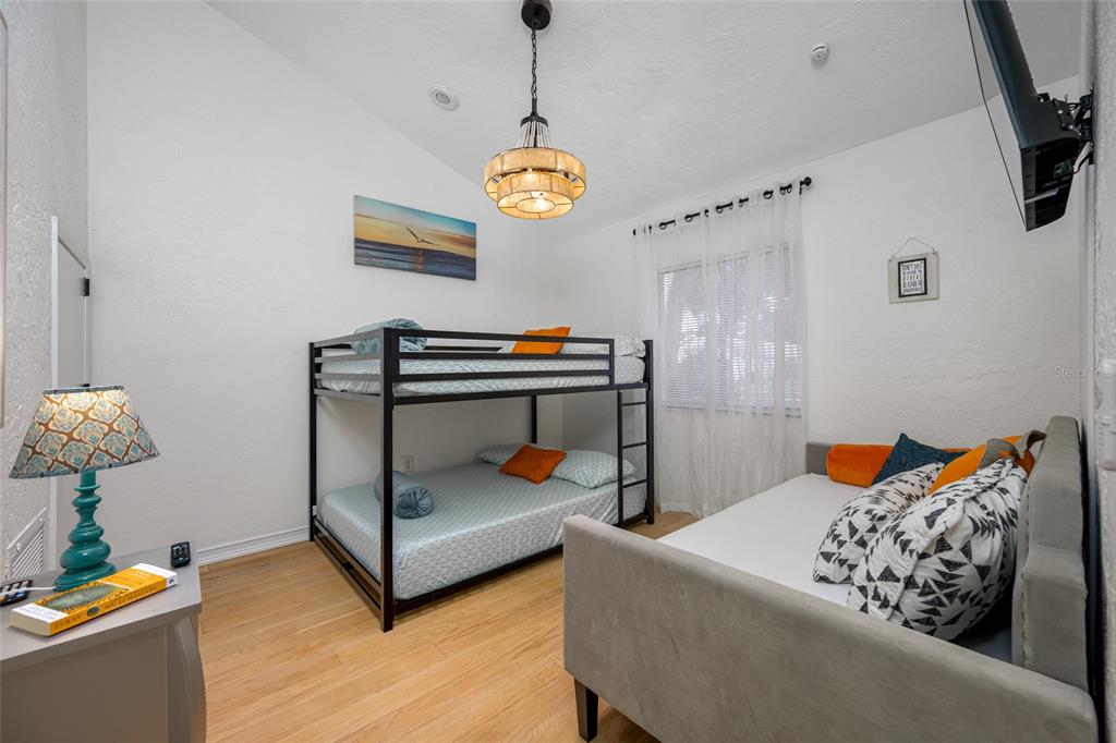 2153 Karan Way Clearwater, FL 33763 - Photo 19 of 65 a bedroom with furniture and a window