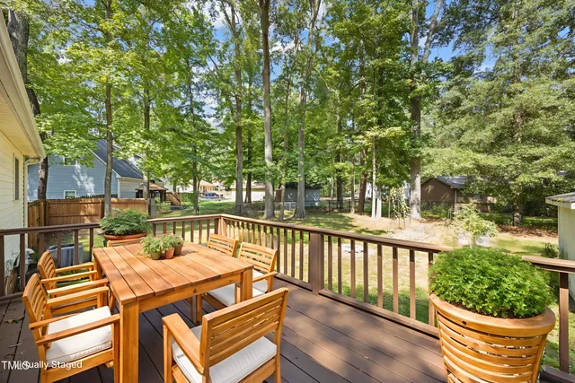 a view of a chairs and table in the balcony