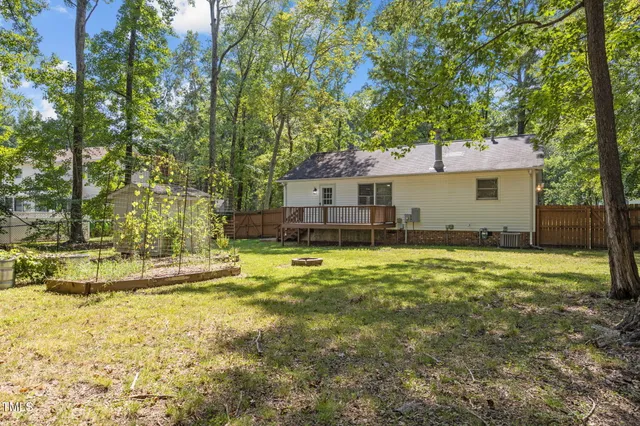 a house view with swimming pool in front of it