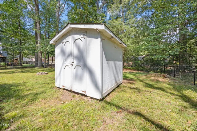 a view of a wooden house with a yard