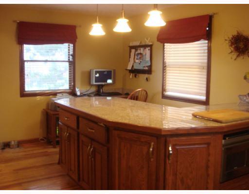 1718 Greentree Road Pittsburgh, PA 15220 - Photo 6 of 12 Kitchen. Kitchen island with plenty of seating room for family also desk area, hard wood floors and granite counter top