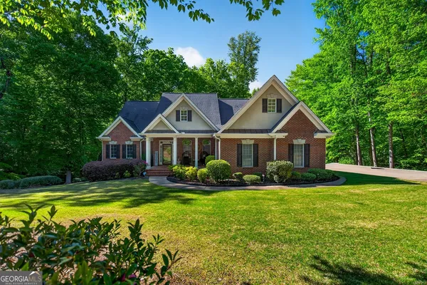 a front view of a house with garden