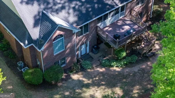 a white toilet sitting next to a bathroom sink and vanity