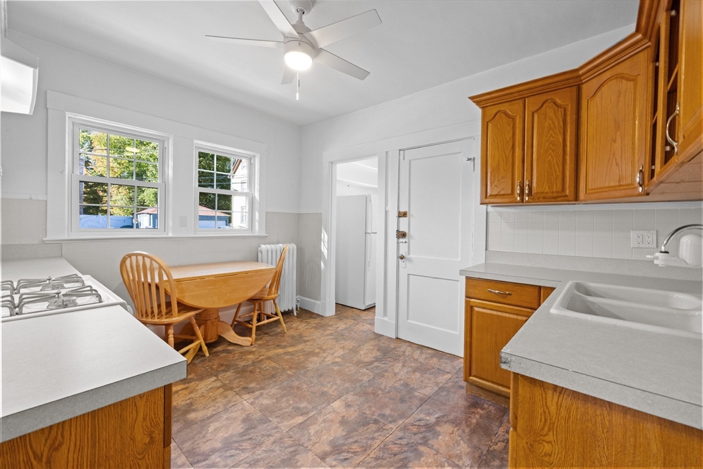 19 Alabama Street, Unit 1 Boston, MA 02126 - Photo 3 of 16 a view of a kitchen with a sink and a dishwasher