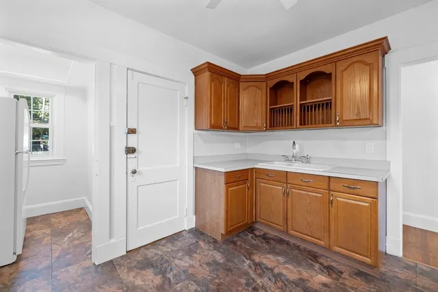 a kitchen that has a sink and a stove in it