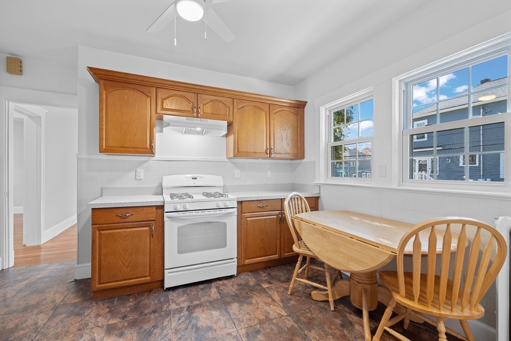 19 Alabama Street, Unit 1 Boston, MA 02126 - Photo 5 of 16 a kitchen with a stove a sink and a refrigerator