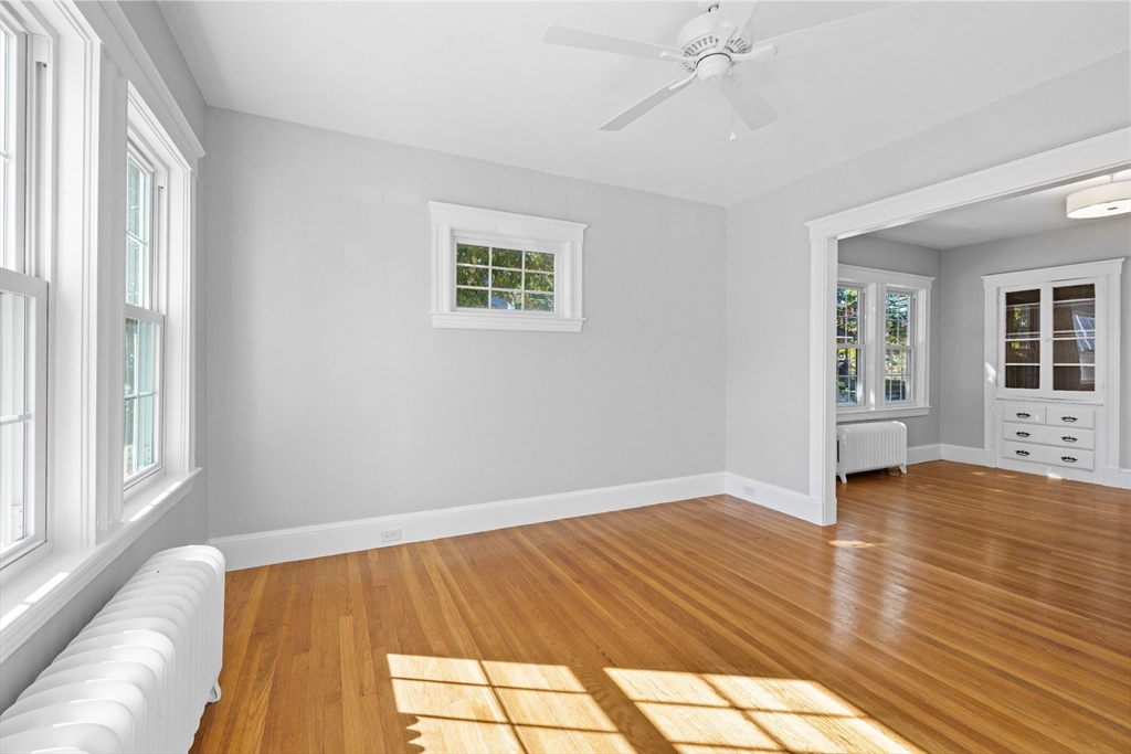 19 Alabama Street, Unit 1 Boston, MA 02126 - Photo 7 of 16 a view of an empty room with wooden floor and a window