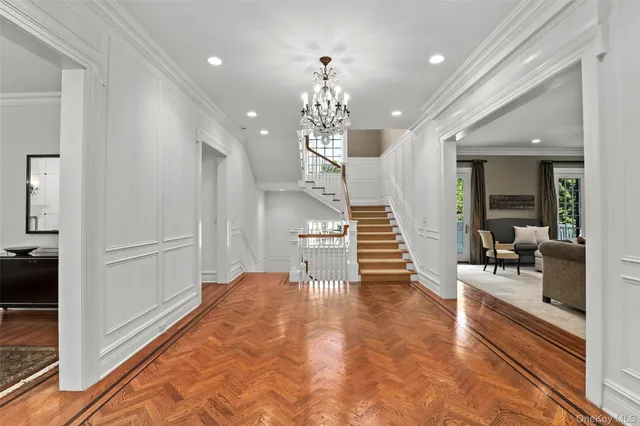 a view of a hallway with the kitchen and dining room view