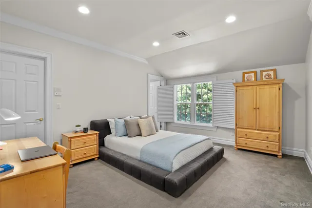 a bedroom with a bed and a cabinets