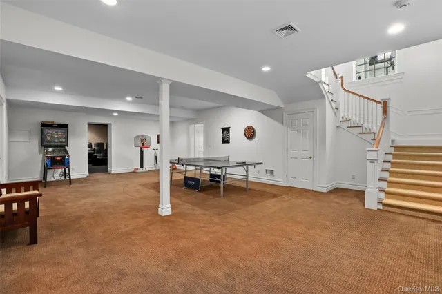 an empty room with furniture and white walls