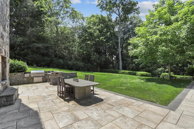 a view of a patio with a yard
