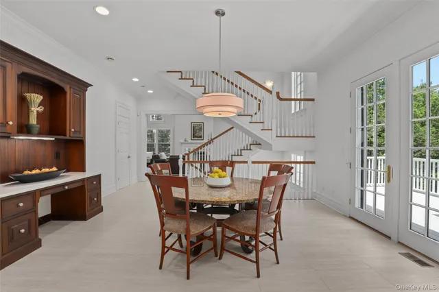 a view of a dining room and livingroom with furniture
