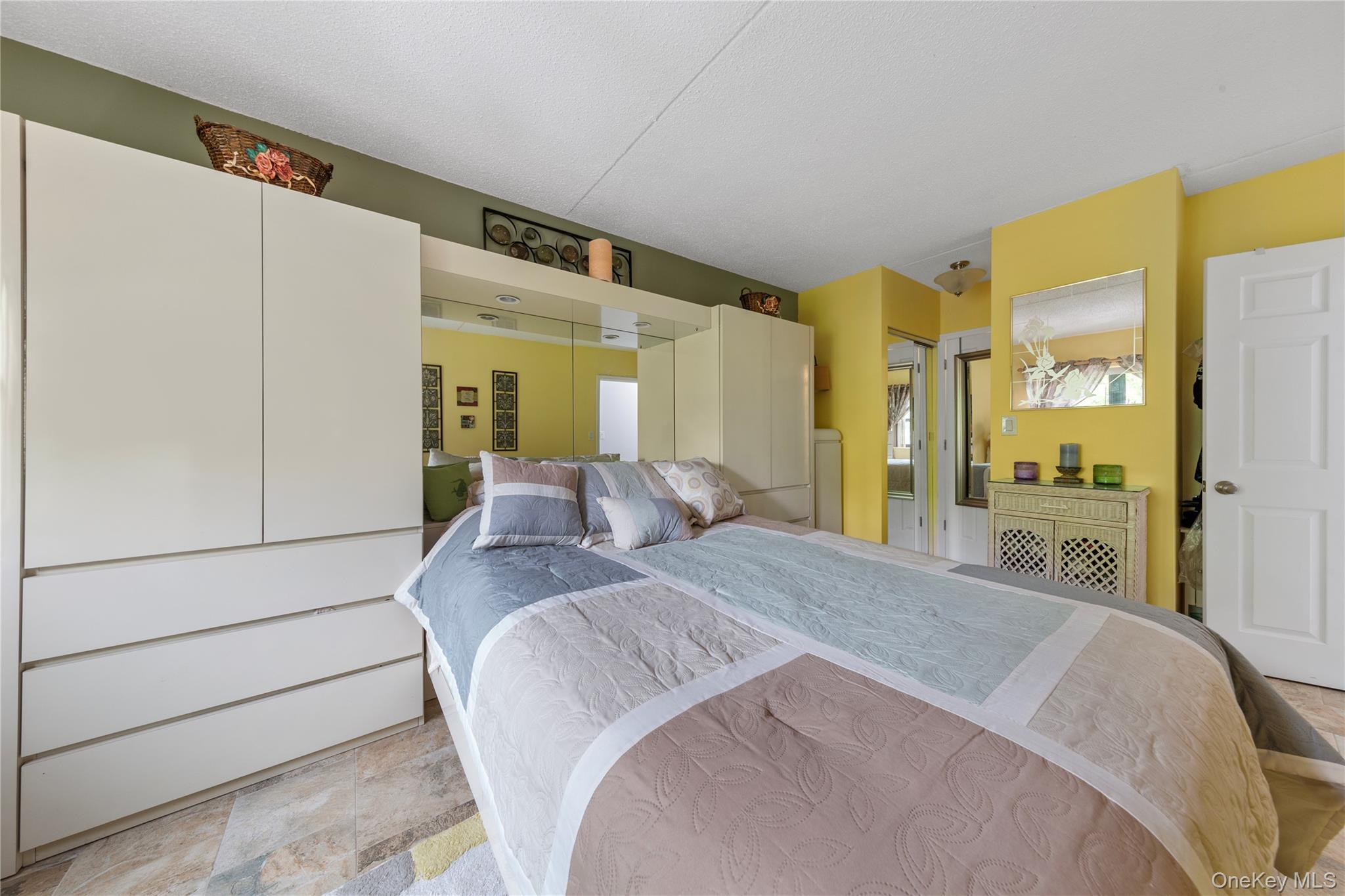 71-28 Sutton Place, Unit 3 Queens, NY 11365 - Photo 11 of 23 Bedroom with light stone finish flooring