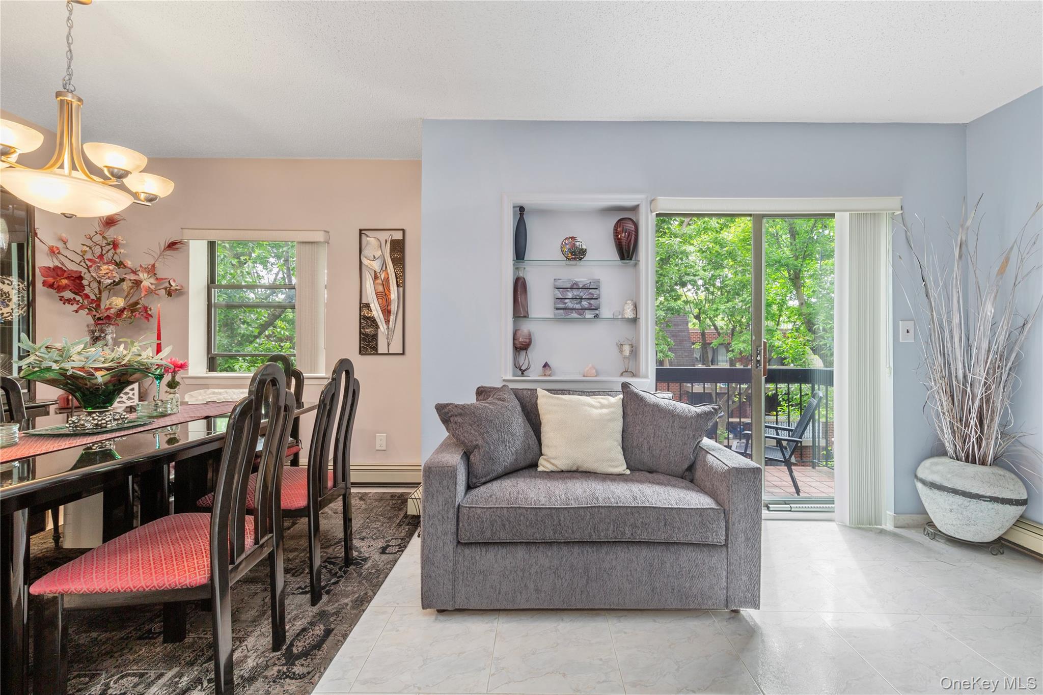 71-28 Sutton Place, Unit 3 Queens, NY 11365 - Photo 7 of 23 Dining area featuring a chandelier
