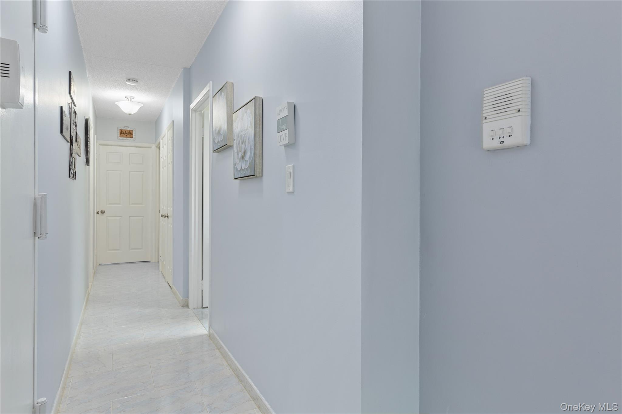 71-28 Sutton Place, Unit 3 Queens, NY 11365 - Photo 9 of 23 Hall featuring baseboards