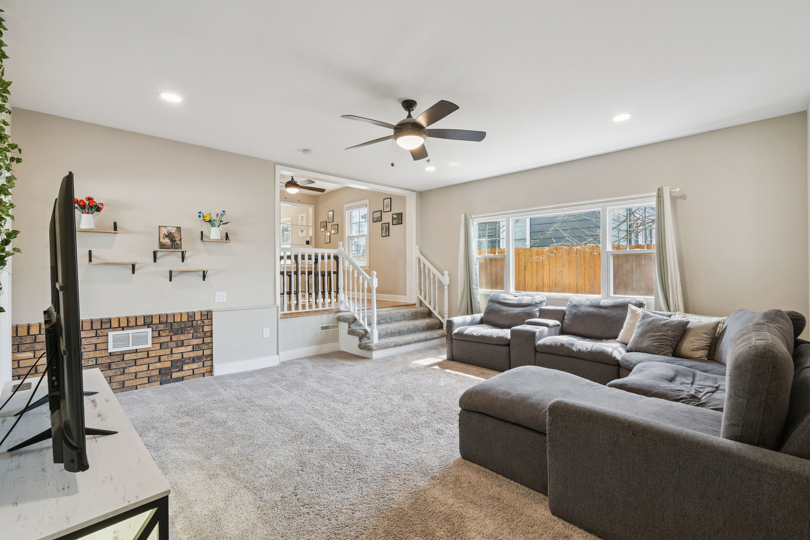 2052 37th Street Rock Island, IL 61201 - Photo 8 of 28 a living room with furniture and a flat screen tv