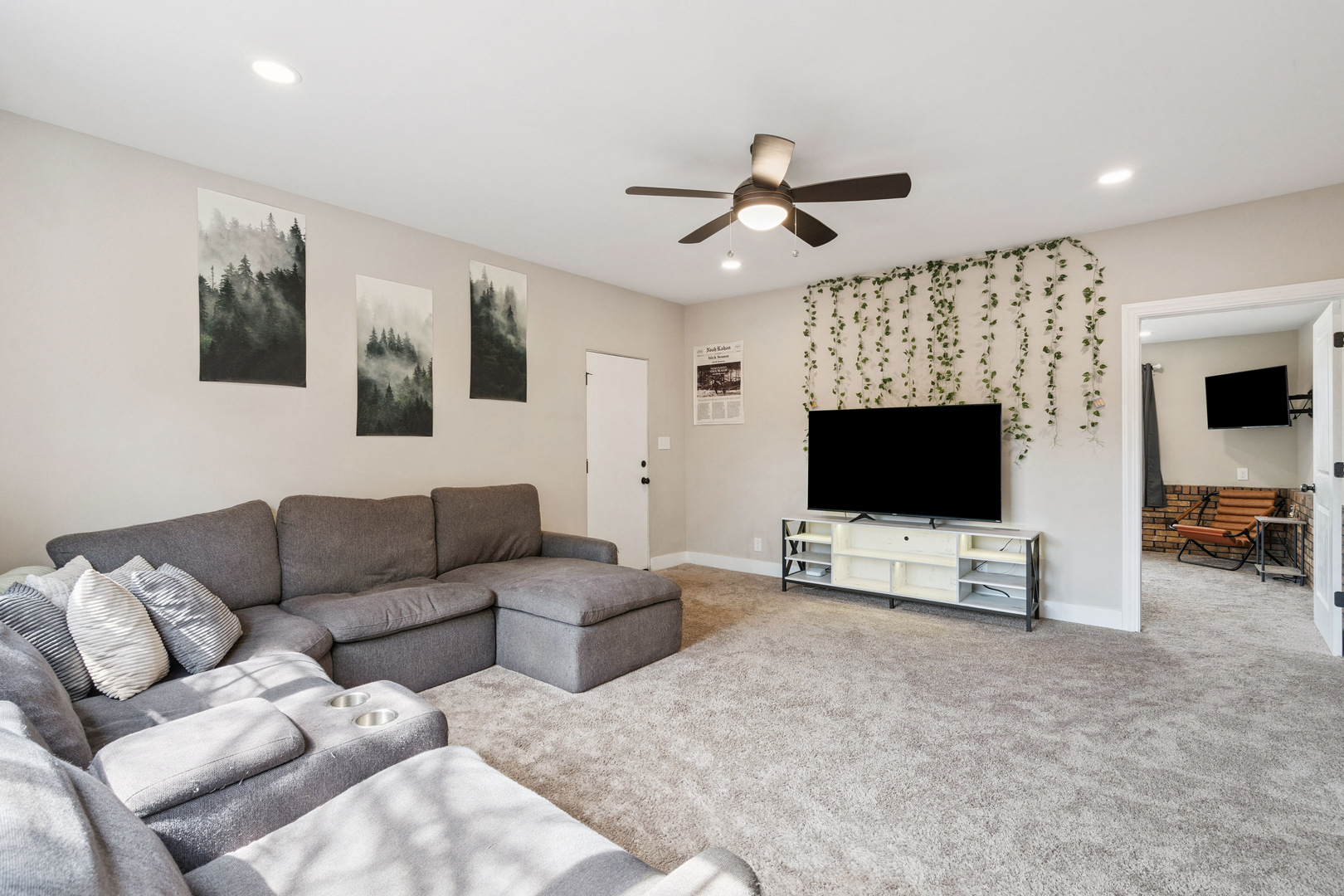 2052 37th Street Rock Island, IL 61201 - Photo 9 of 28 a living room with furniture and a flat screen tv
