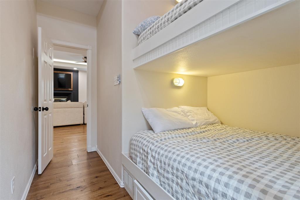 106 White Oak Mabank, TX 75156 - Photo 13 of 32 a bedroom with a bed and a view of balcony