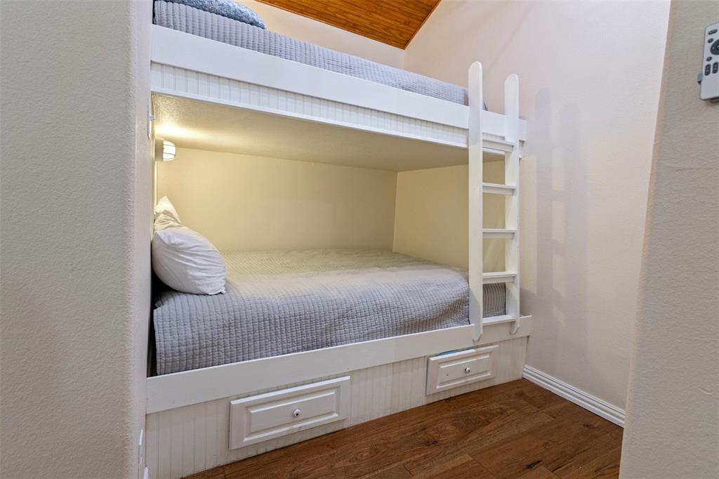 106 White Oak Mabank, TX 75156 - Photo 18 of 32 a en suite bathroom with a granite countertop sink and a mirror
