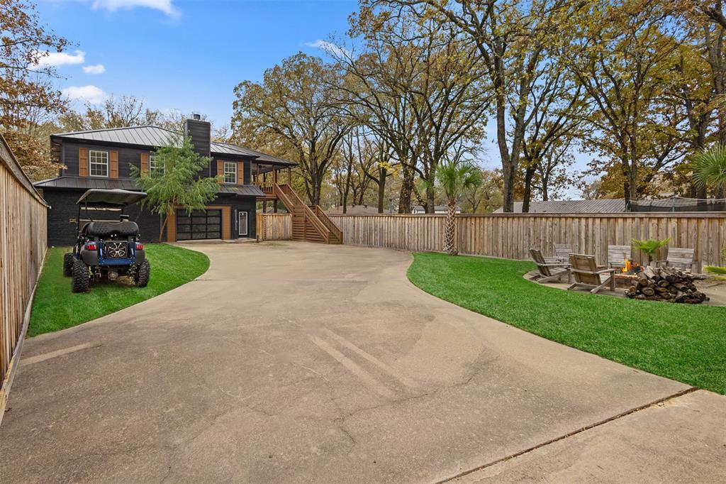 106 White Oak Mabank, TX 75156 - Photo 2 of 32 a view of a chair and table in the backyard